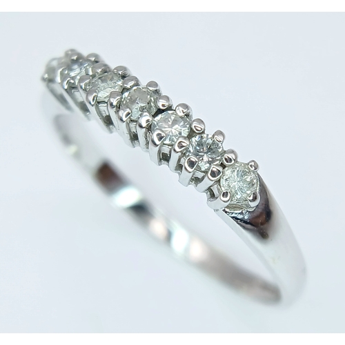 412 - A 9K White Gold, Diamond Set, 7 Stone Ring. 0.15Tcw, 1.5G, Size N. Sc 6012