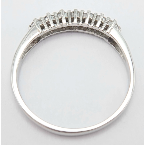 412 - A 9K White Gold, Diamond Set, 7 Stone Ring. 0.15Tcw, 1.5G, Size N. Sc 6012