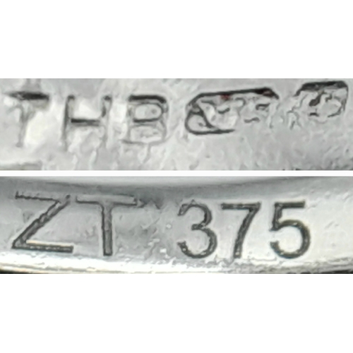 265 - An Attractive 9 Carat White Gold Tanzanite and Diamond Set Ring Size O. The Ring is set with a 5mm T... 