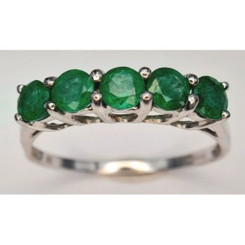 293 - A Stylish 9 Carat White Gold and Five Emerald Set Ring Size N. Set with Five 4mm Quality Round Cut E... 
