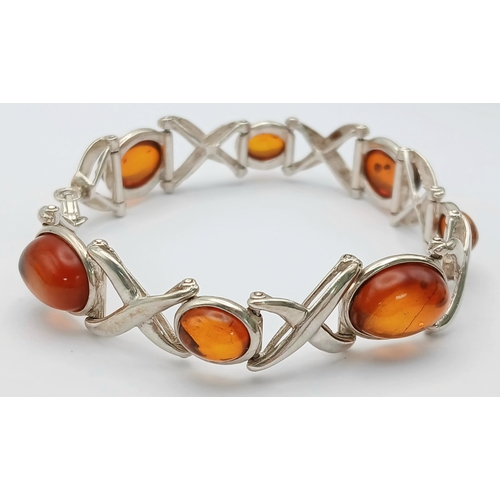 404 - A Vintage Sterling Silver, Baltic Cognac Amber Bracelet-19cm Length. 1.3cm Width. Gross weight 20.76... 