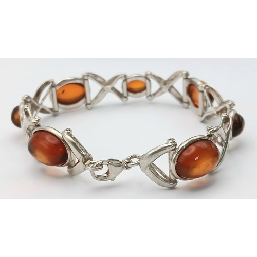 404 - A Vintage Sterling Silver, Baltic Cognac Amber Bracelet-19cm Length. 1.3cm Width. Gross weight 20.76... 