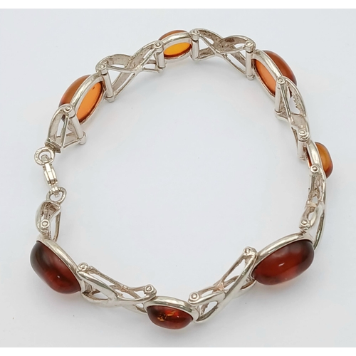 404 - A Vintage Sterling Silver, Baltic Cognac Amber Bracelet-19cm Length. 1.3cm Width. Gross weight 20.76... 