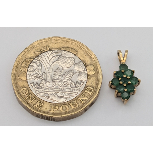 397 - An Elegant 9K Yellow Gold and Emerald Cluster Pendant. 1.5cm Length. Set with Eight 2mm Round Cut Em... 