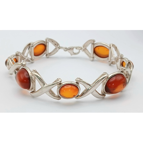 404 - A Vintage Sterling Silver, Baltic Cognac Amber Bracelet-19cm Length. 1.3cm Width. Gross weight 20.76... 