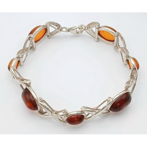 404 - A Vintage Sterling Silver, Baltic Cognac Amber Bracelet-19cm Length. 1.3cm Width. Gross weight 20.76... 