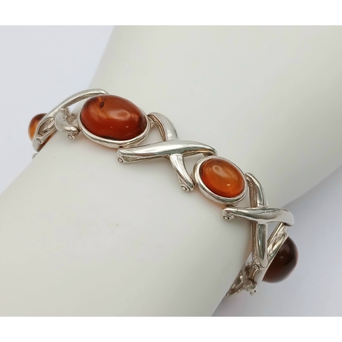 404 - A Vintage Sterling Silver, Baltic Cognac Amber Bracelet-19cm Length. 1.3cm Width. Gross weight 20.76... 