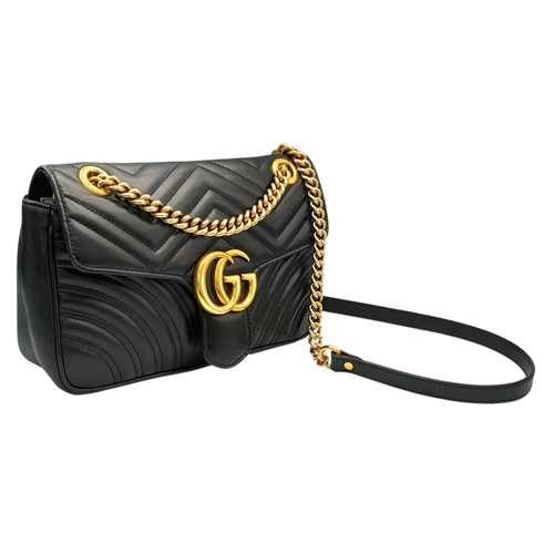 213 - A Black Gucci GG Marmont Matelassé Shoulder Bag. Black leather exterior with gold-toned hardware, ch... 