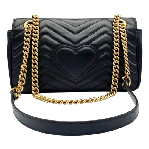 213 - A Black Gucci GG Marmont Matelassé Shoulder Bag. Black leather exterior with gold-toned hardware, ch... 