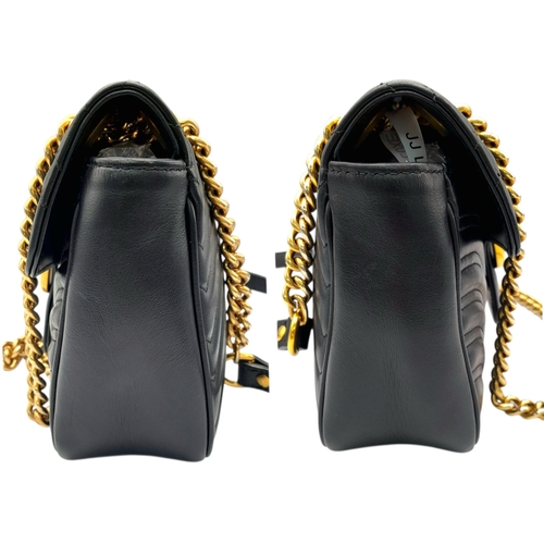 213 - A Black Gucci GG Marmont Matelassé Shoulder Bag. Black leather exterior with gold-toned hardware, ch... 