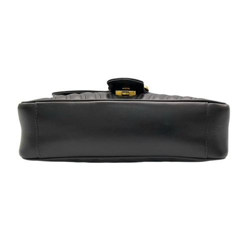 213 - A Black Gucci GG Marmont Matelassé Shoulder Bag. Black leather exterior with gold-toned hardware, ch... 