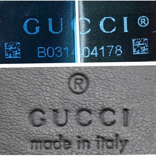 213 - A Black Gucci GG Marmont Matelassé Shoulder Bag. Black leather exterior with gold-toned hardware, ch... 