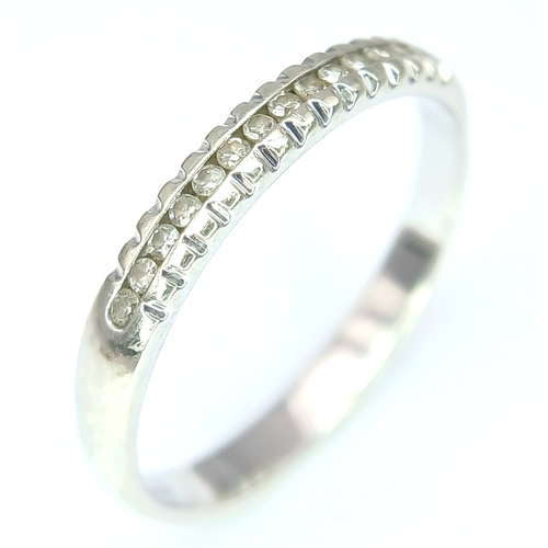 272 - A Stylish 9 Carat White Gold and Channel Set Fifteen Diamond Ring-Size P. The Ring is set with fifte... 
