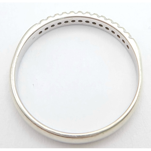 272 - A Stylish 9 Carat White Gold and Channel Set Fifteen Diamond Ring-Size P. The Ring is set with fifte... 