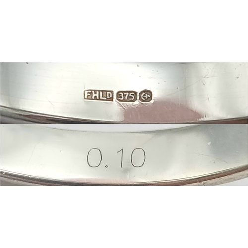 272 - A Stylish 9 Carat White Gold and Channel Set Fifteen Diamond Ring-Size P. The Ring is set with fifte... 