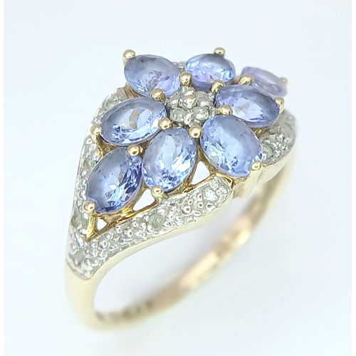 279 - A Wonderful 9 Carat Gold Tanzanite and Diamond Ring Size M. The Ring is set with Eight 5 x 3mm Oval ... 