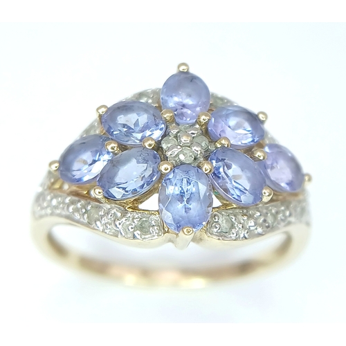 279 - A Wonderful 9 Carat Gold Tanzanite and Diamond Ring Size M. The Ring is set with Eight 5 x 3mm Oval ... 