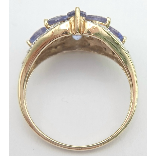 279 - A Wonderful 9 Carat Gold Tanzanite and Diamond Ring Size M. The Ring is set with Eight 5 x 3mm Oval ... 