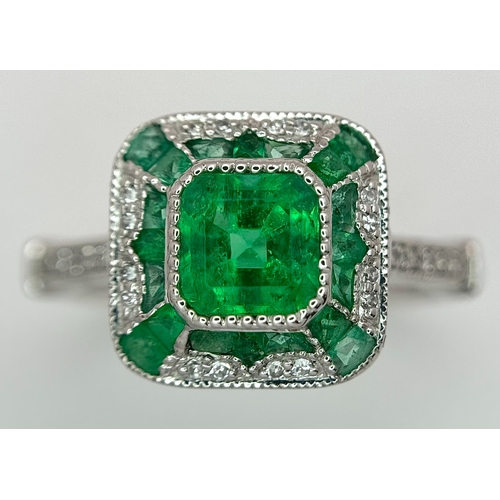 292 - A Head-Turning 950 Platinum, Emerald and Diamond Cocktail Ring. 0.85ctw of Colombian mixed cut emera... 