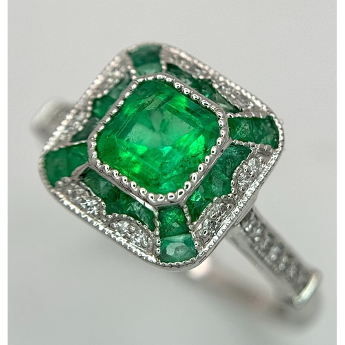 292 - A Head-Turning 950 Platinum, Emerald and Diamond Cocktail Ring. 0.85ctw of Colombian mixed cut emera... 