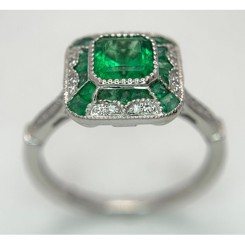 292 - A Head-Turning 950 Platinum, Emerald and Diamond Cocktail Ring. 0.85ctw of Colombian mixed cut emera... 