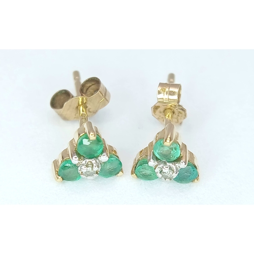 418 - A Pretty Pair of 9K Gold Emerald and Diamond Stud Earrings. 6mm Wide. Set with Three Round Cut Emera... 