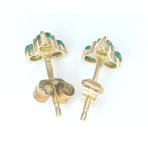 418 - A Pretty Pair of 9K Gold Emerald and Diamond Stud Earrings. 6mm Wide. Set with Three Round Cut Emera... 