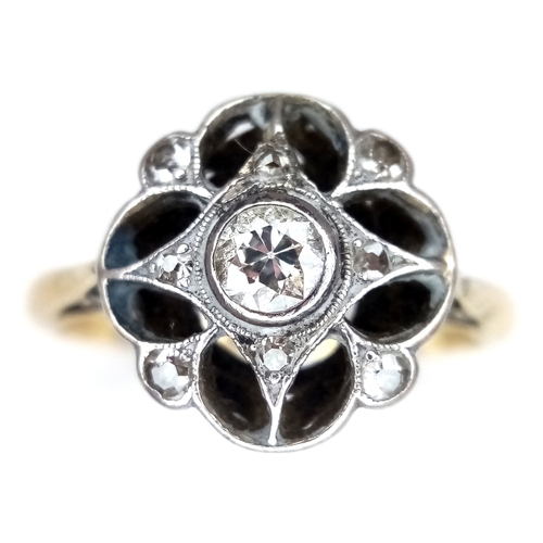 58 - An Antique Edwardian 18K Gold and Platinum Diamond Daisy Cluster Ring. Central diamond surrounded by... 