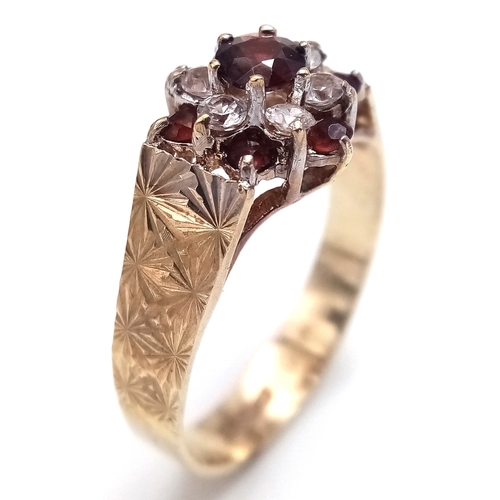 182 - Vintage 9 CARAT GOLD RING. Clear hallmark for Birmingham 1977 . Having Garnet and Zirconia Detail. 2... 
