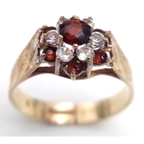 182 - Vintage 9 CARAT GOLD RING. Clear hallmark for Birmingham 1977 . Having Garnet and Zirconia Detail. 2... 