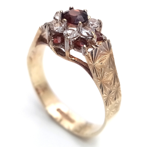 182 - Vintage 9 CARAT GOLD RING. Clear hallmark for Birmingham 1977 . Having Garnet and Zirconia Detail. 2... 