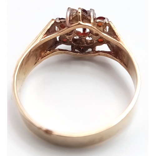 182 - Vintage 9 CARAT GOLD RING. Clear hallmark for Birmingham 1977 . Having Garnet and Zirconia Detail. 2... 