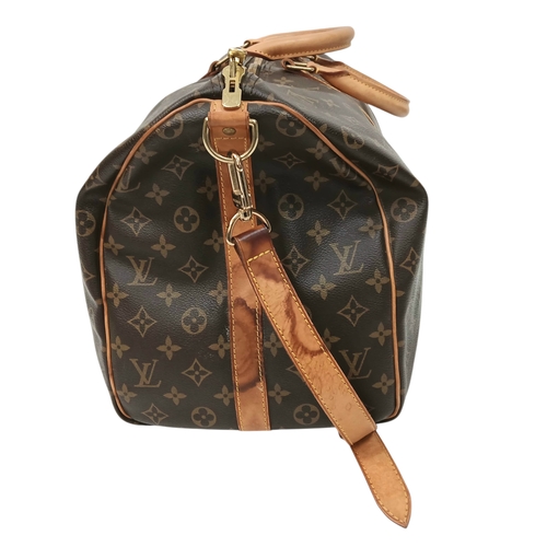 197 - A Brown Louis Vuitton Monogram Keepall 50 Travel Bag. Brown monogram coated canvas exterior with gol... 