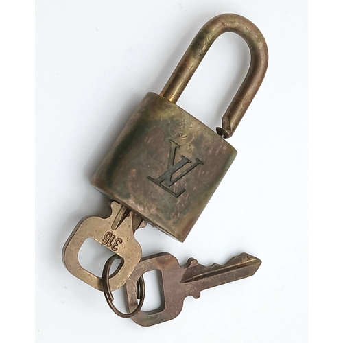 197 - A Brown Louis Vuitton Monogram Keepall 50 Travel Bag. Brown monogram coated canvas exterior with gol... 