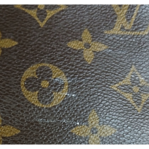 197 - A Brown Louis Vuitton Monogram Keepall 50 Travel Bag. Brown monogram coated canvas exterior with gol... 