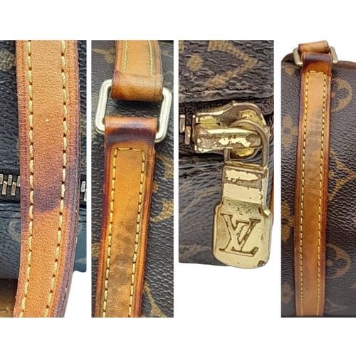 204 - A Louis Vuitton Monogram Papillon 26 Hand Bag. Crafted in brown LV monogram coated canvas with light... 