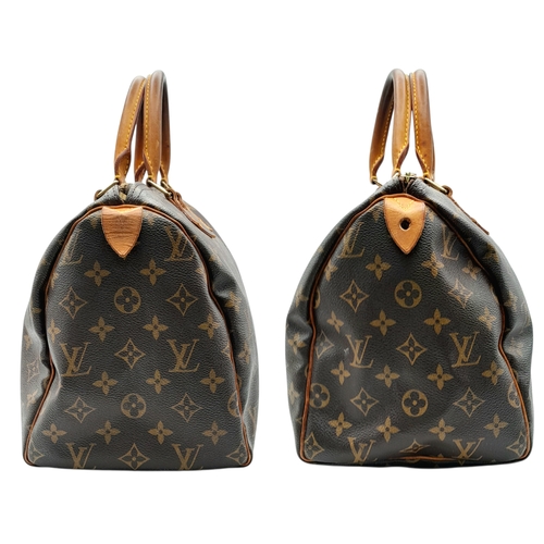 225 - A Brown Louis Vuitton Monogram Speedy 30 Bag. Brown monogram coated canvas exterior with gold-toned ... 