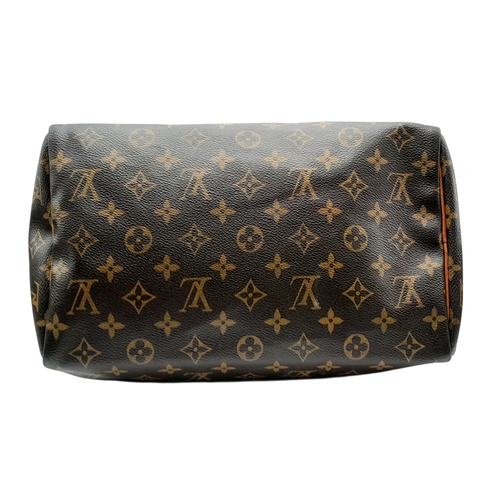 225 - A Brown Louis Vuitton Monogram Speedy 30 Bag. Brown monogram coated canvas exterior with gold-toned ... 