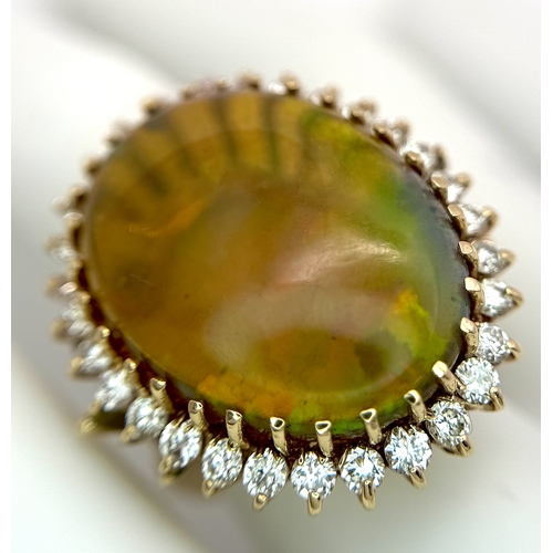 23 - A Stunning Large Opal and Diamond Dress Ring set in 18K Gold. A golden oval cut opal c. 20ct with fa... 