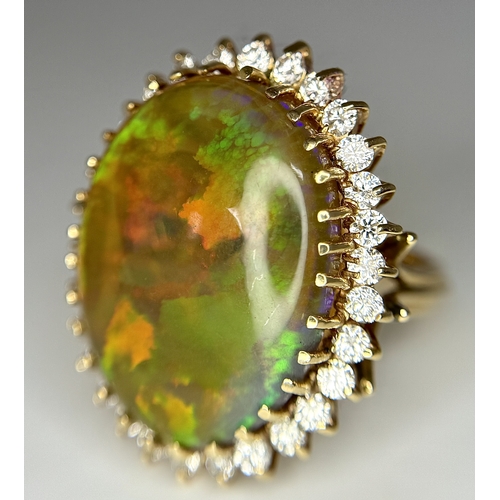 23 - A Stunning Large Opal and Diamond Dress Ring set in 18K Gold. A golden oval cut opal c. 20ct with fa... 