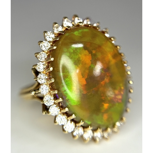 23 - A Stunning Large Opal and Diamond Dress Ring set in 18K Gold. A golden oval cut opal c. 20ct with fa... 