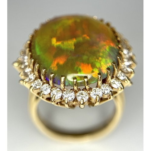23 - A Stunning Large Opal and Diamond Dress Ring set in 18K Gold. A golden oval cut opal c. 20ct with fa... 
