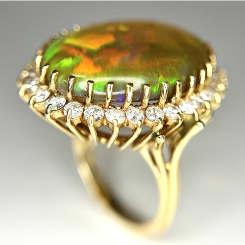 23 - A Stunning Large Opal and Diamond Dress Ring set in 18K Gold. A golden oval cut opal c. 20ct with fa... 