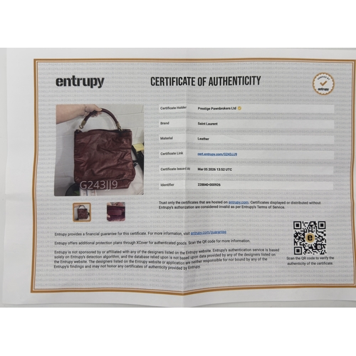 275 - A Yves Saint Laurent Roady Hobo Bag. Burgundy leather exterior with gold-tone hardware and a single ... 