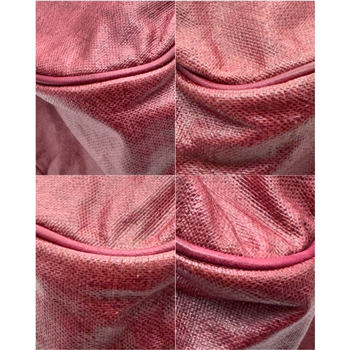 275 - A Yves Saint Laurent Roady Hobo Bag. Burgundy leather exterior with gold-tone hardware and a single ... 