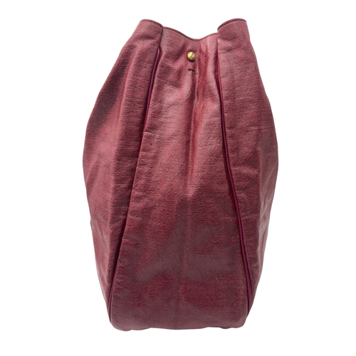 275 - A Yves Saint Laurent Roady Hobo Bag. Burgundy leather exterior with gold-tone hardware and a single ... 