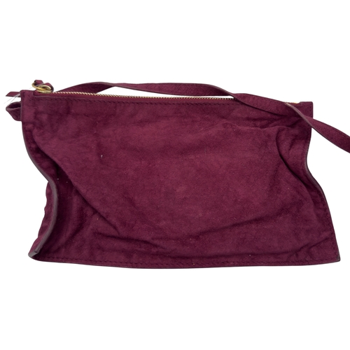 275 - A Yves Saint Laurent Roady Hobo Bag. Burgundy leather exterior with gold-tone hardware and a single ... 