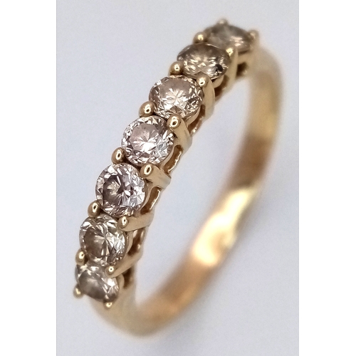 156 - A 14K Yellow Gold Seven Stone Diamond Ring. 0.66ctw of round brilliant cut tinted diamonds with SI2 ... 