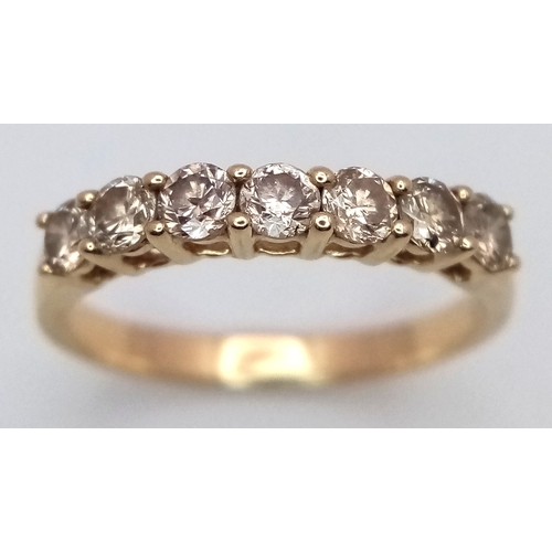 156 - A 14K Yellow Gold Seven Stone Diamond Ring. 0.66ctw of round brilliant cut tinted diamonds with SI2 ... 