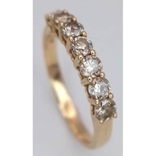 156 - A 14K Yellow Gold Seven Stone Diamond Ring. 0.66ctw of round brilliant cut tinted diamonds with SI2 ... 